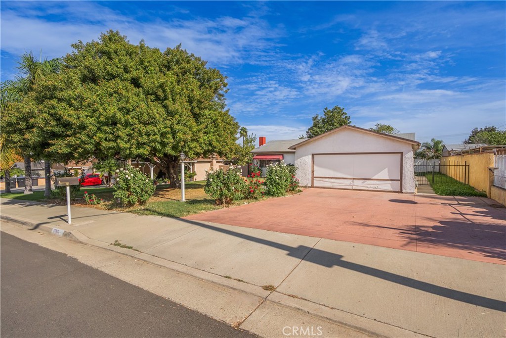 6084 Vanessa Street Riverside, CA 92504 - Photo 35 of 35 a front view of a house with a yard and garage