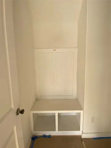 a picture of a refrigerator in a white kitchen