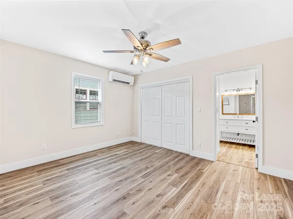 a view of bathroom with a shower and a glass door