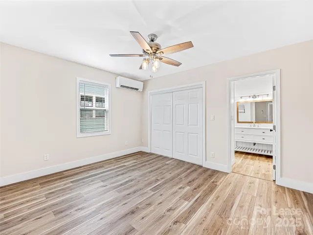a view of bathroom with a shower and a glass door