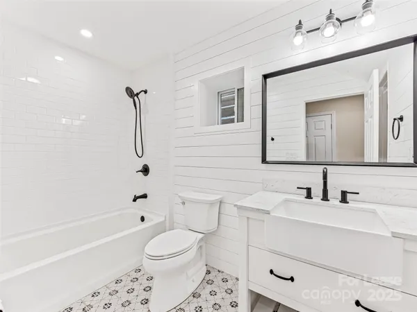 a bedroom with a bed and a fireplace