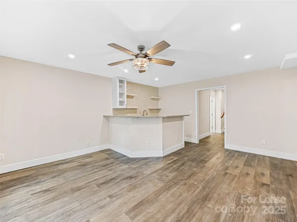 a kitchen with a sink cabinets and window