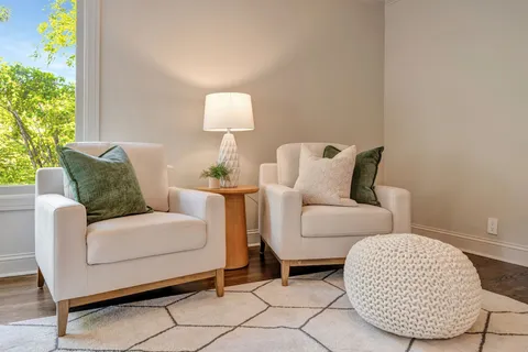 a living room with furniture and a table