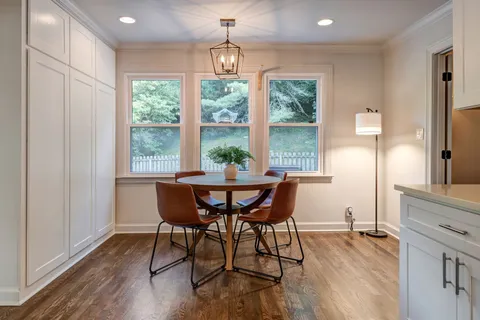 a bathroom with a sink a light fixture and a mirror