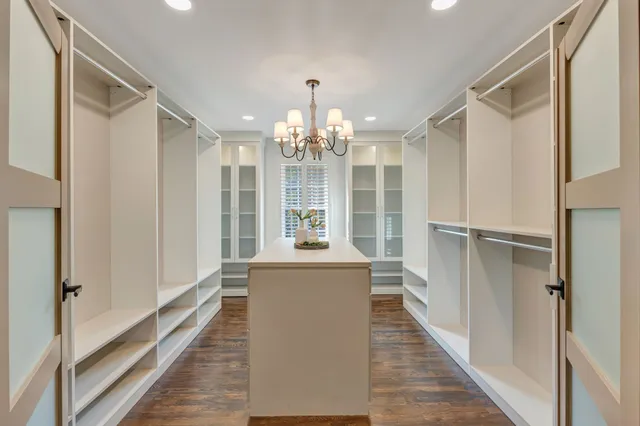 a bathroom with a tub a sink and mirrors