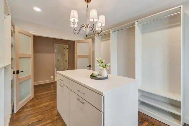 a bath tub sitting in a bathroom next to a window