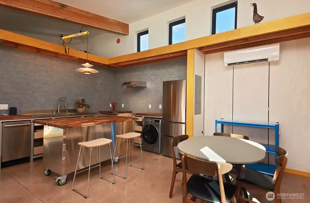 a balcony with table and chairs