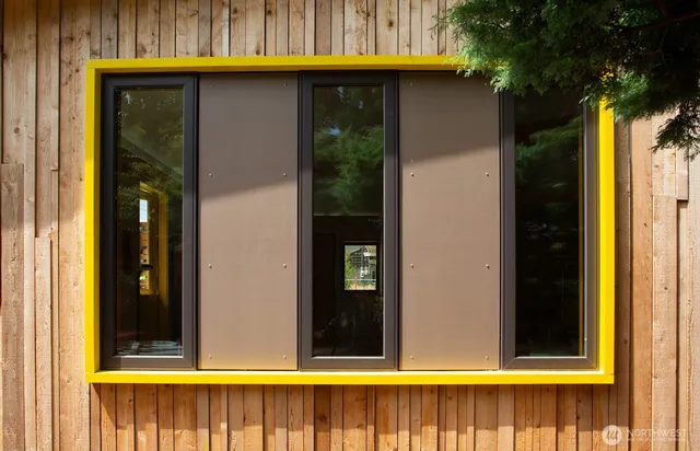 a balcony with table and chairs