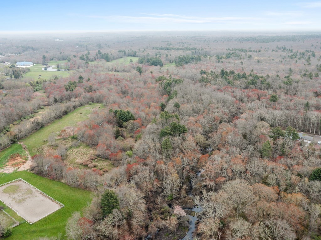 an aerial view of house with yard
