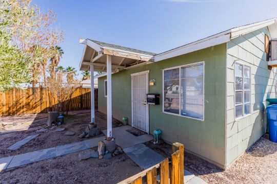 249 North Alvord Street Ridgecrest, CA 93555 - Photo 27 of 39 a backyard of a house with seating space
