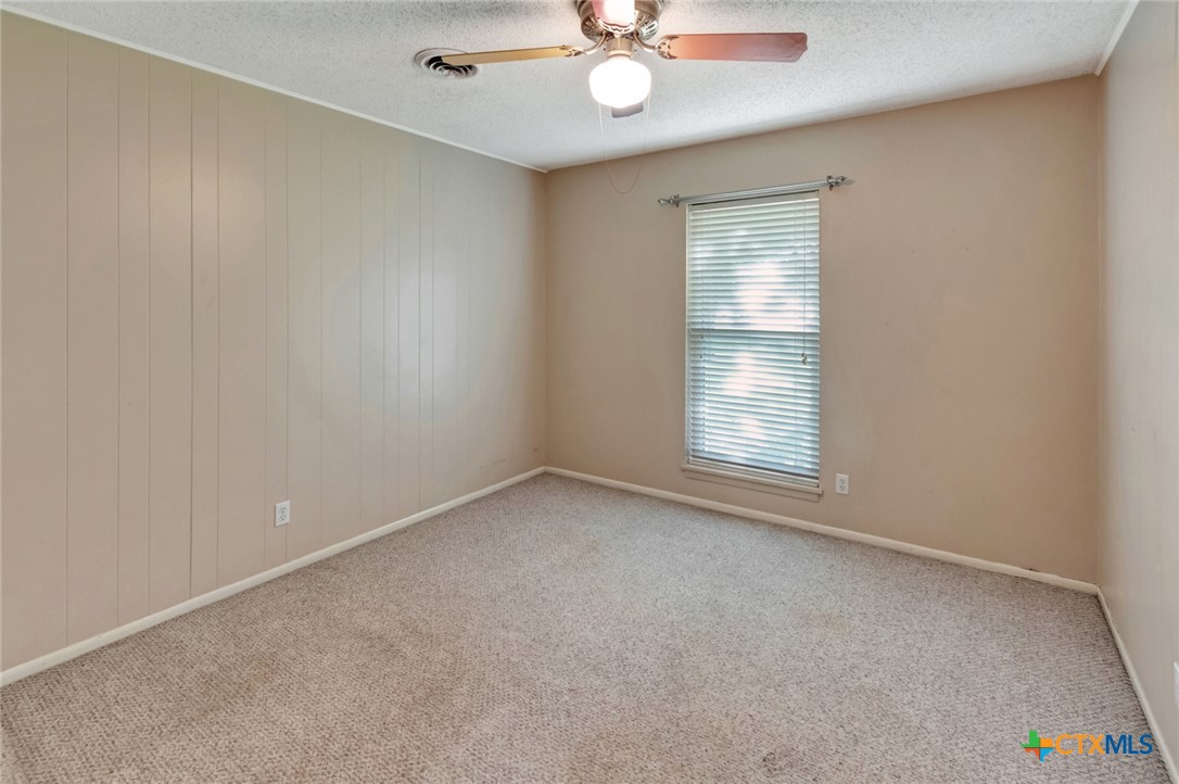 919 Eden Roc Street Victoria, TX 77904 - Photo 17 of 36 a view of an empty room with a window