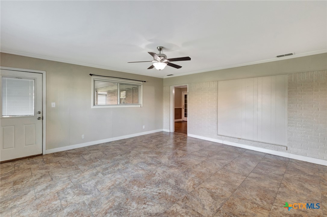 919 Eden Roc Street Victoria, TX 77904 - Photo 27 of 36 a view of an empty room with a ceiling fan