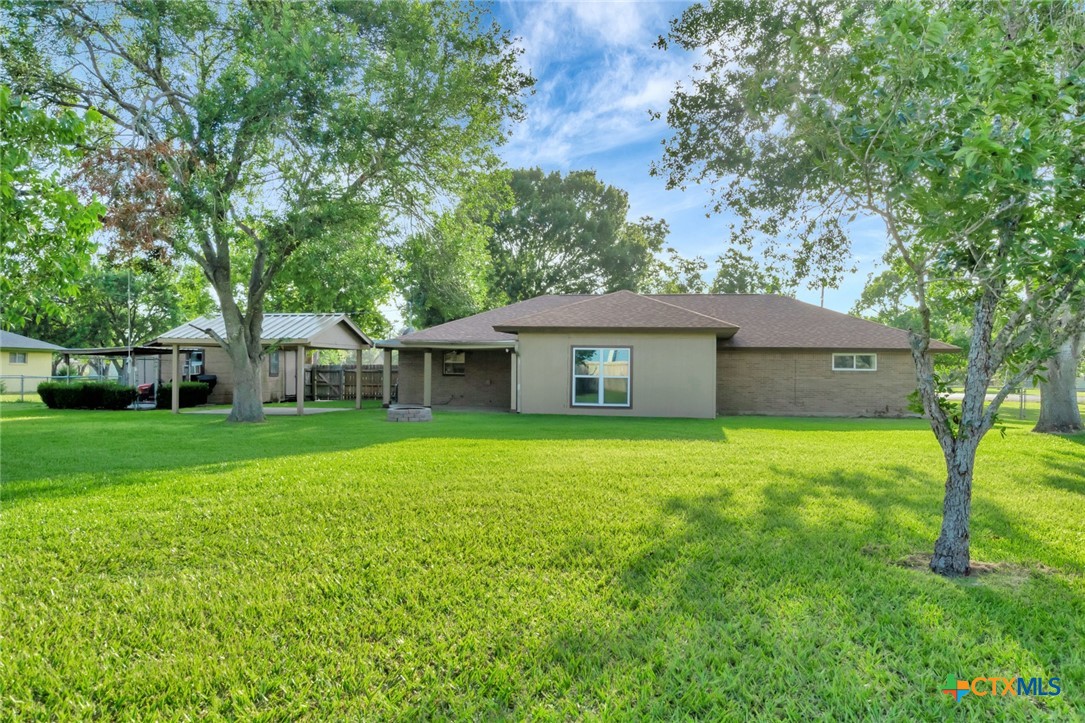 919 Eden Roc Street Victoria, TX 77904 - Photo 33 of 36 a front view of house with yard and trees