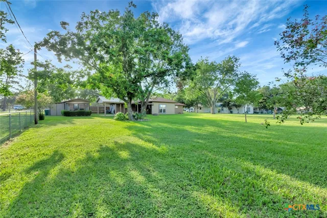 a view of a house with a big yard