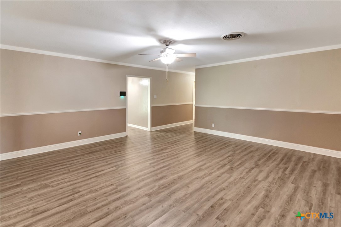 919 Eden Roc Street Victoria, TX 77904 - Photo 7 of 36 wooden floor in an empty room