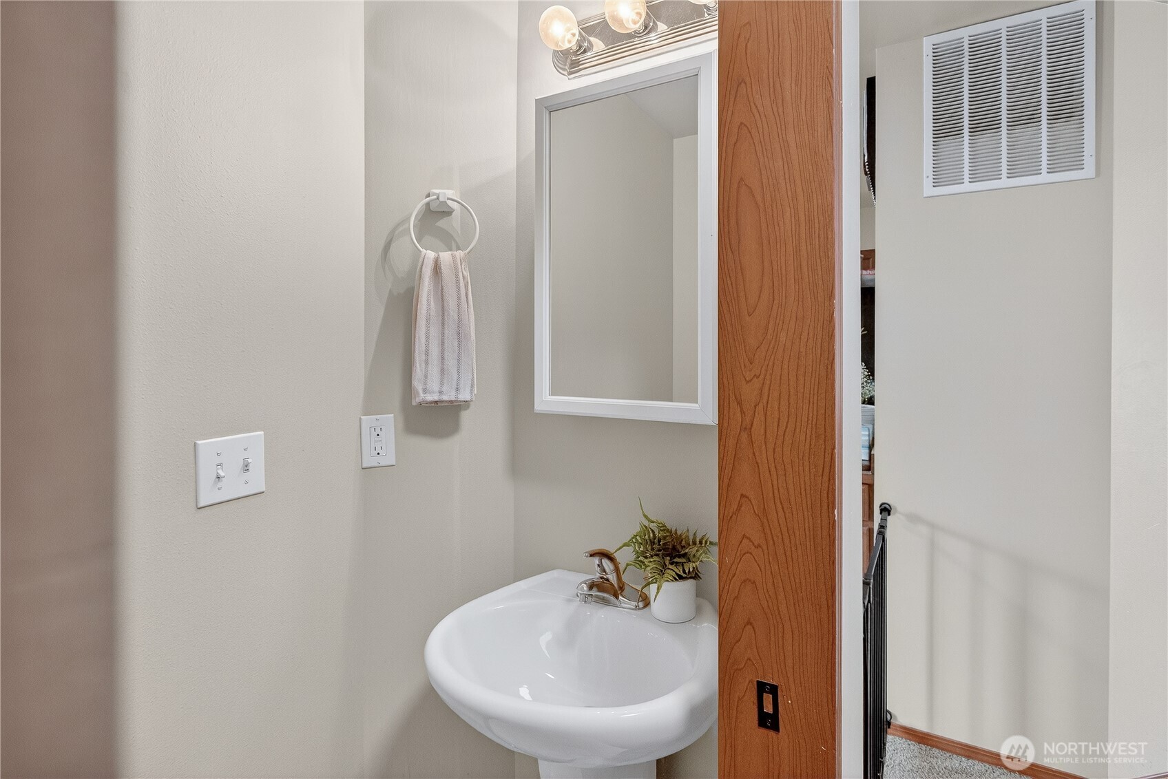 1506 Historic Lane Wenatchee, WA 98801 - Photo 11 of 28 a bathroom with a sink and mirror