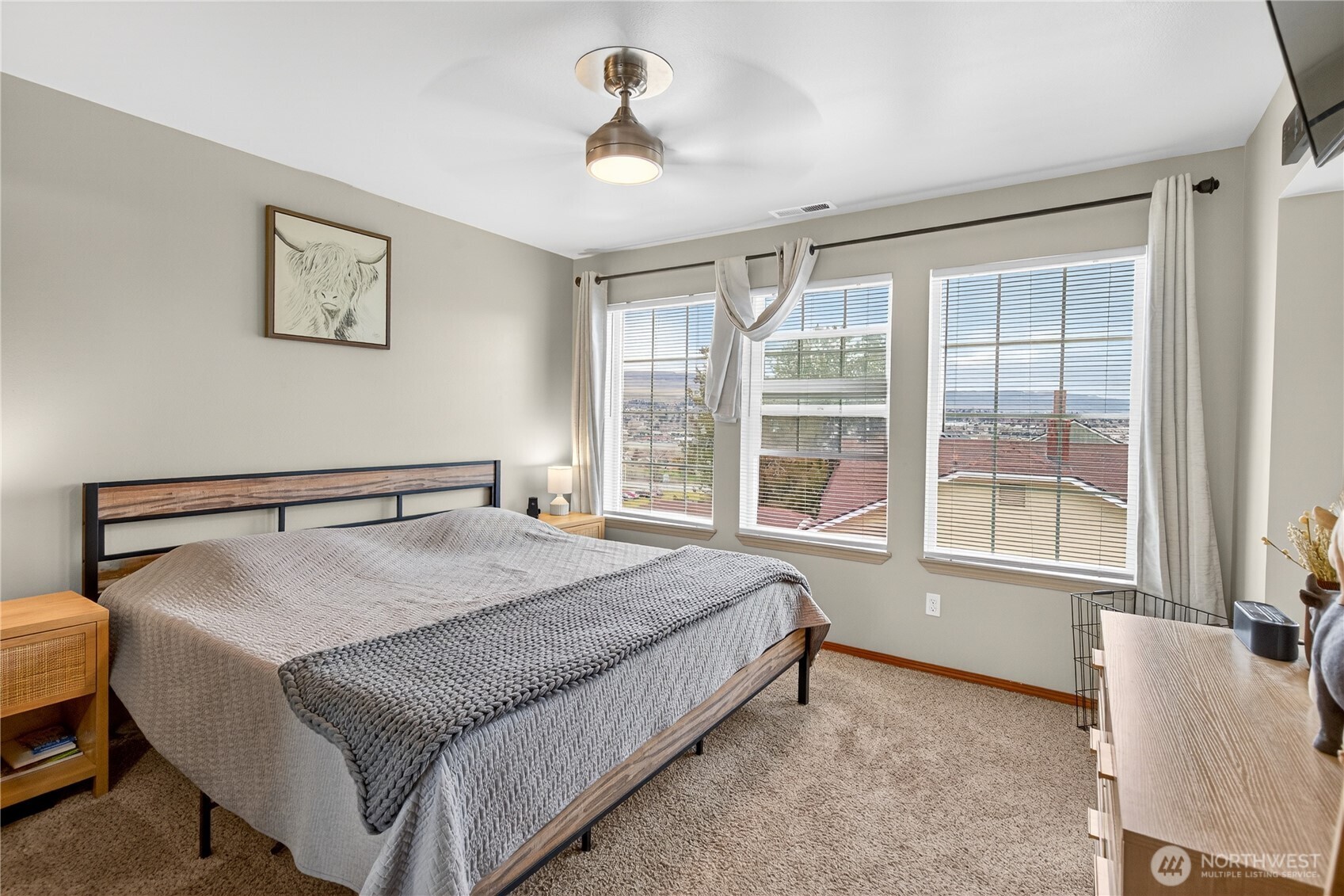 1506 Historic Lane Wenatchee, WA 98801 - Photo 13 of 28 a bedroom with a bed and a large window