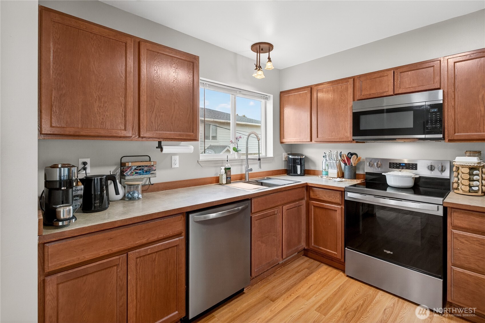 1506 Historic Lane Wenatchee, WA 98801 - Photo 4 of 28 a kitchen with stainless steel appliances granite countertop wooden cabinets a sink and dishwasher