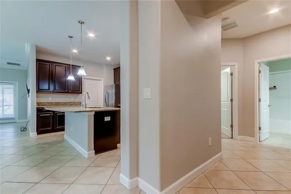 a view of a kitchen with a sink and a stove top oven