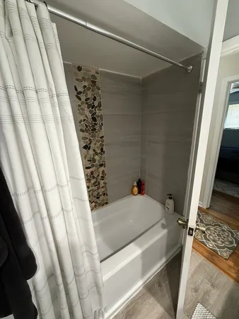 a bathroom with a sink and a shower curtain
