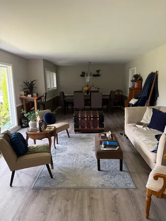 a living room with furniture and a rug