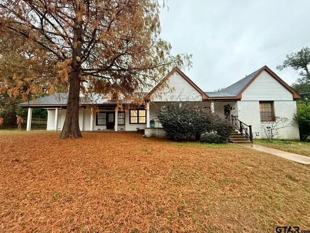 front view of a house with a trees