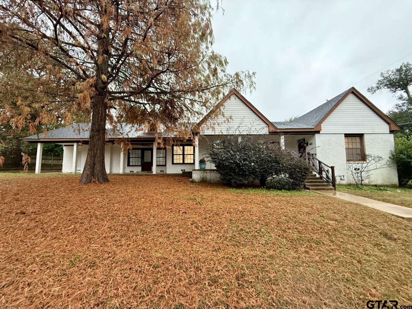 front view of a house with a trees