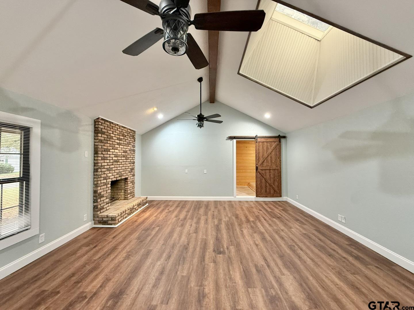 603 Wilma Street Tyler, TX 75701 - Photo 11 of 26 a view of empty room with wooden floor and fan