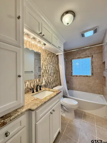 a view of a hallway with closet area