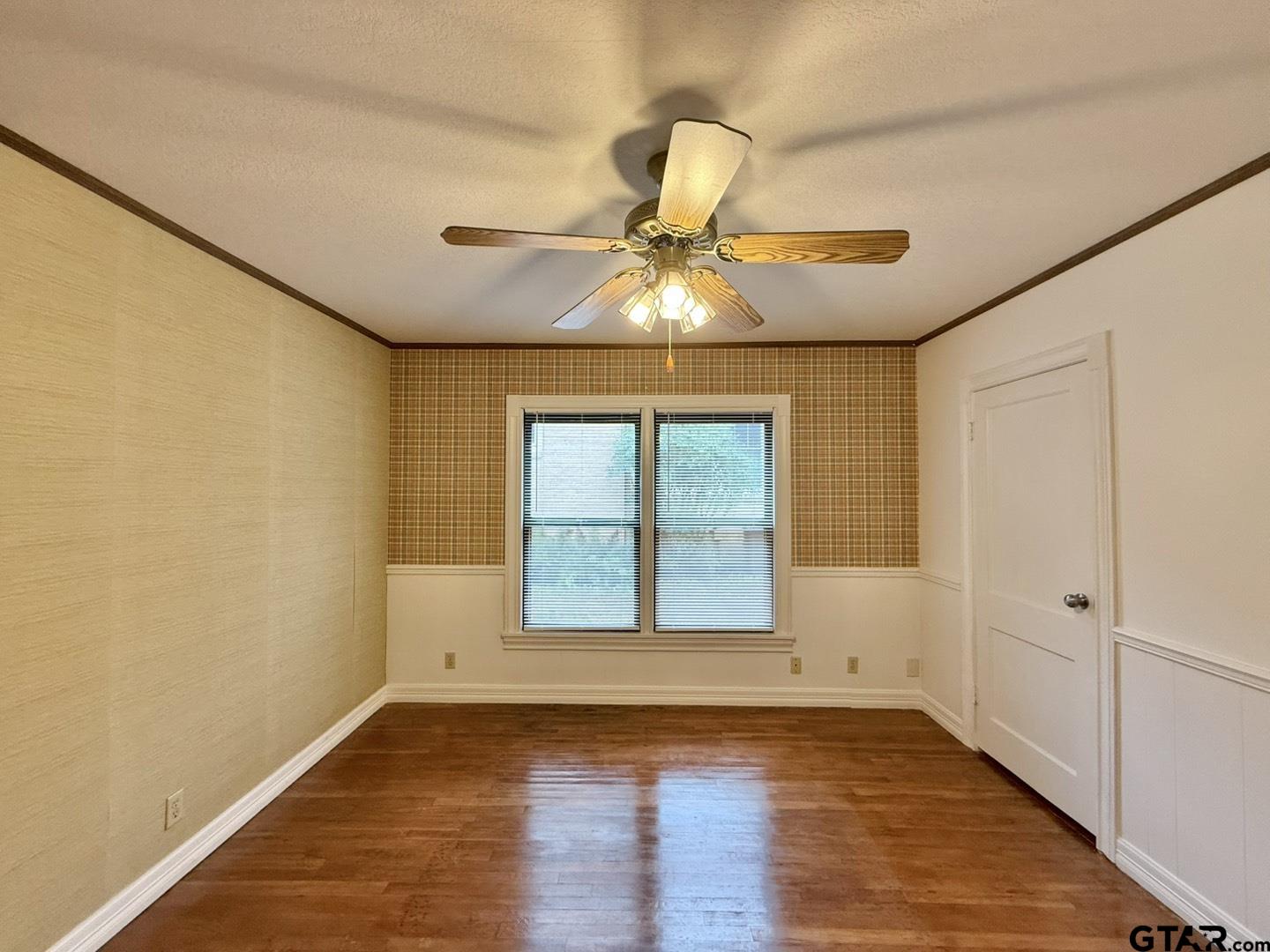 603 Wilma Street Tyler, TX 75701 - Photo 16 of 26 a view of an empty room with window and wooden floor