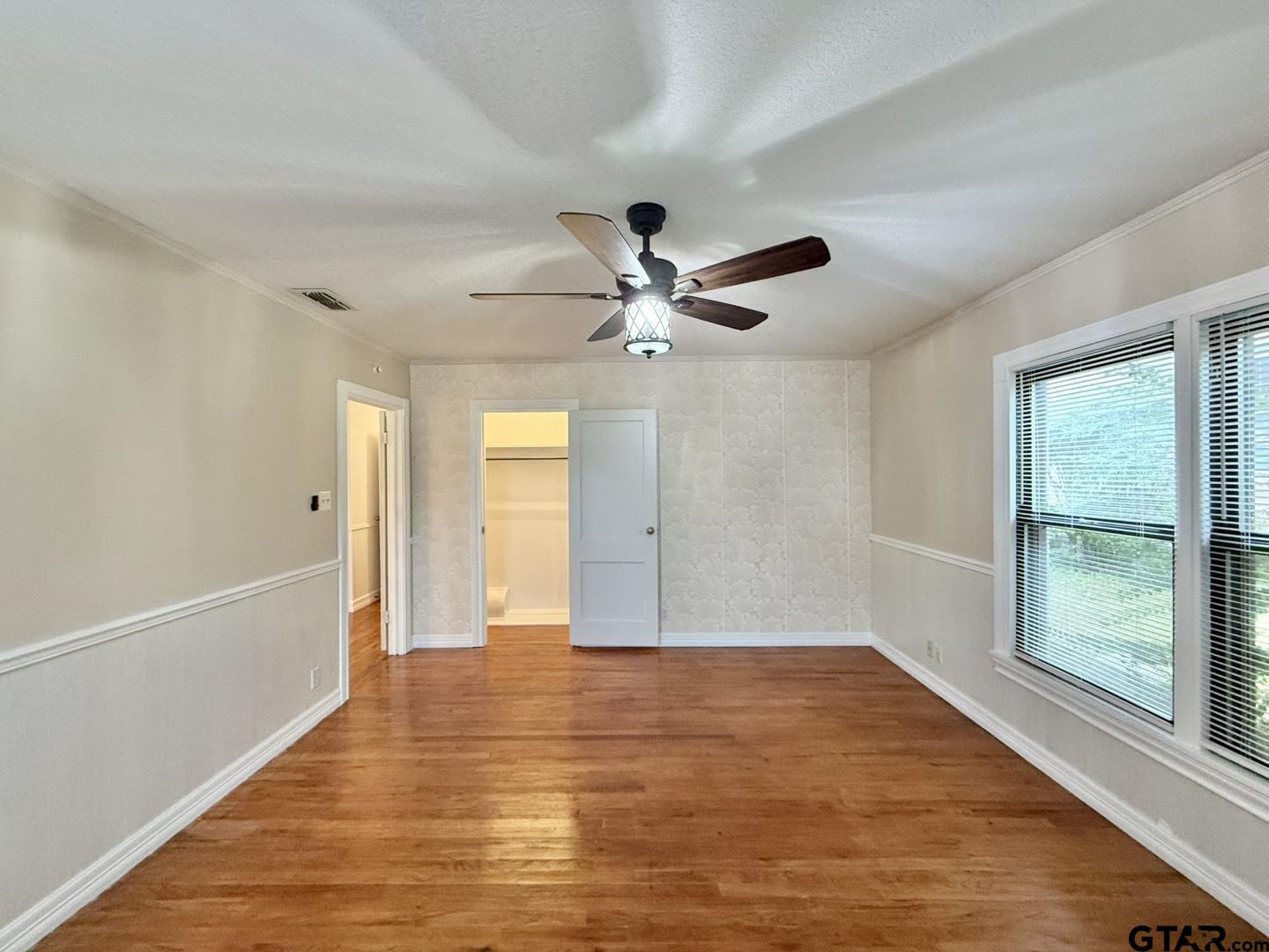 603 Wilma Street Tyler, TX 75701 - Photo 18 of 26 a view of an empty room with window and wooden floor