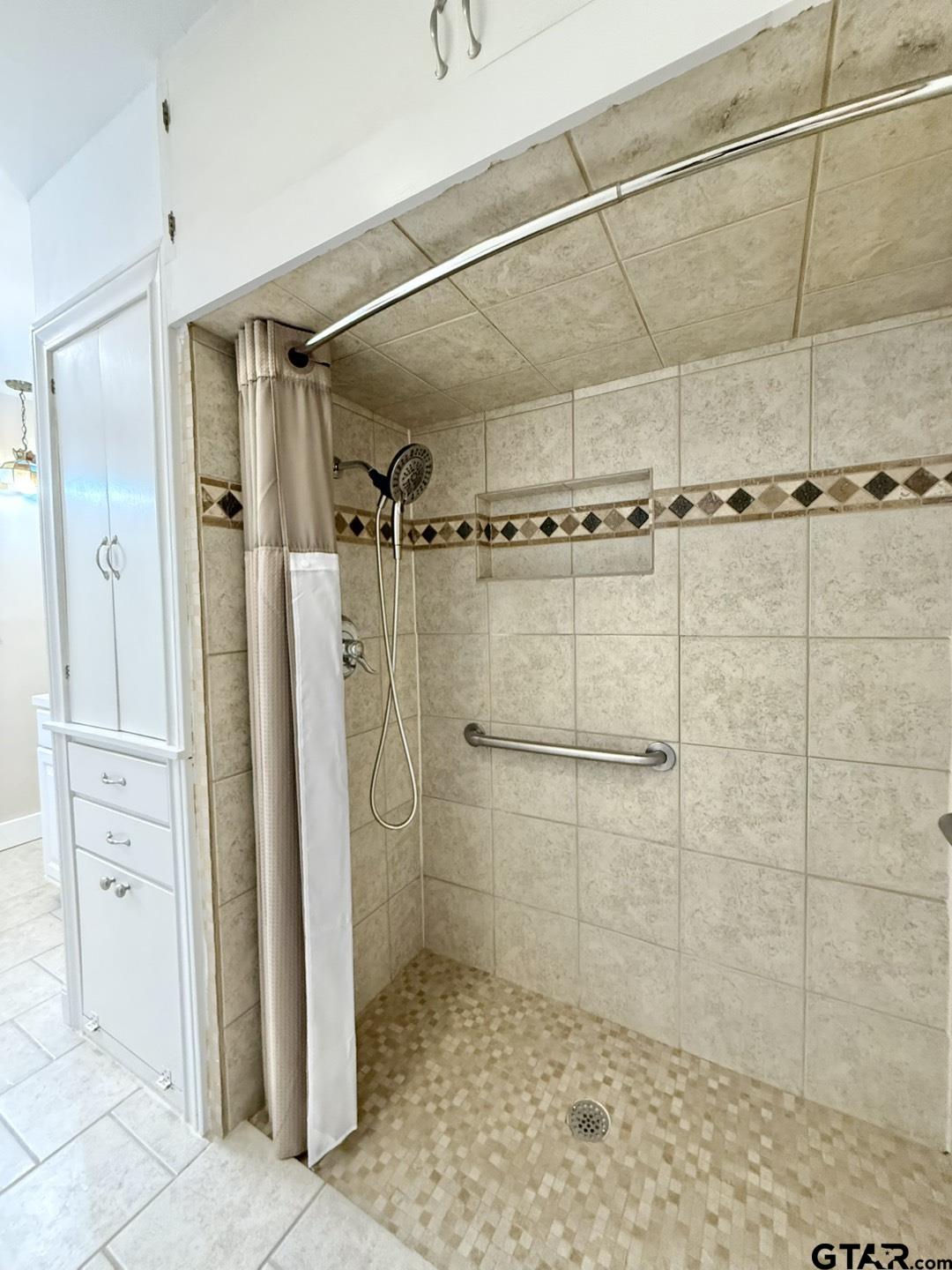 603 Wilma Street Tyler, TX 75701 - Photo 24 of 26 a bathroom with a shower