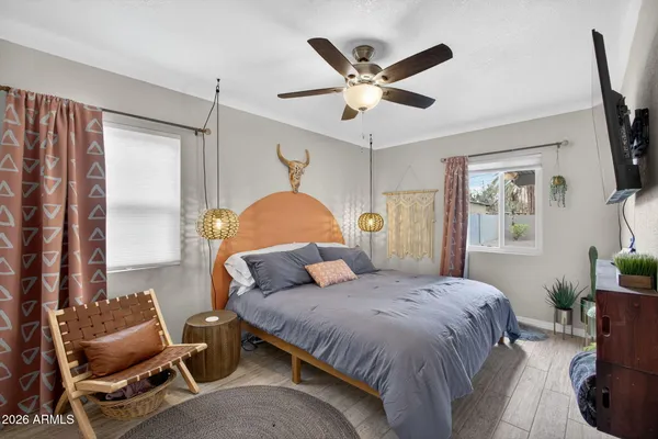 a living room with furniture ceiling fan and a rug