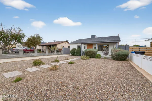 a front view of a house with yard