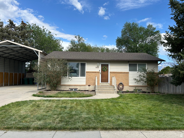 7659 State Street Midvale, UT 84047 - Photo 33 of 33 Single story home featuring brick siding, entry steps, driveway, a carport, and roof with shingles