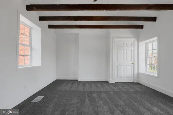 an empty room with windows
