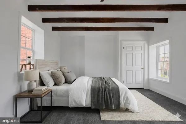 a bedroom with a bed and window