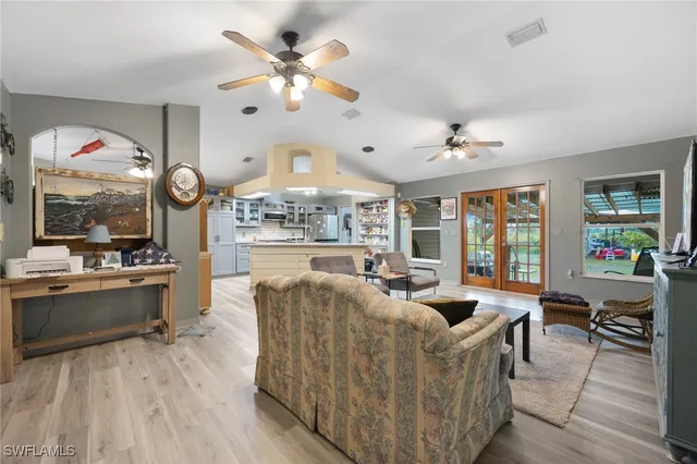 a dining room with furniture a window and wooden floor
