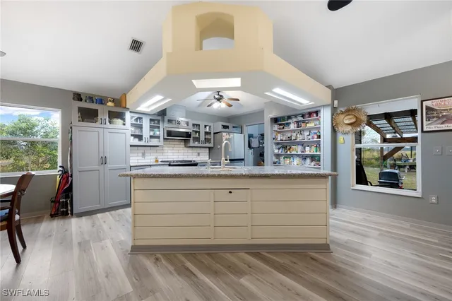 a bedroom with a bed and ceiling fan