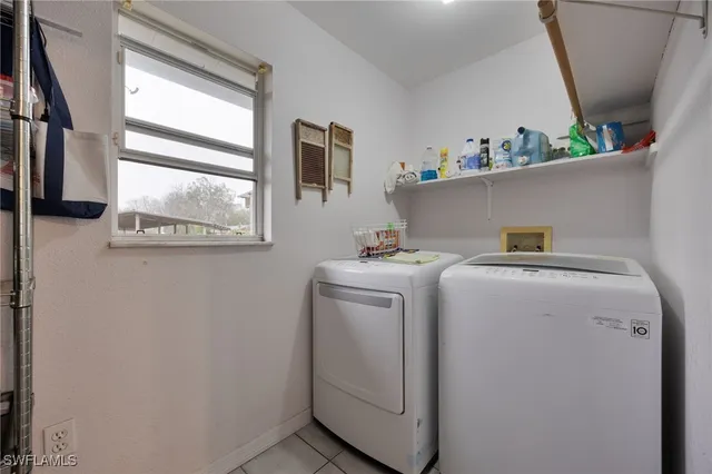 a view of a big house with a big yard and large trees