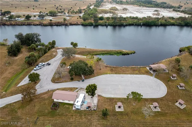 a view of a porch with furniture and a yard
