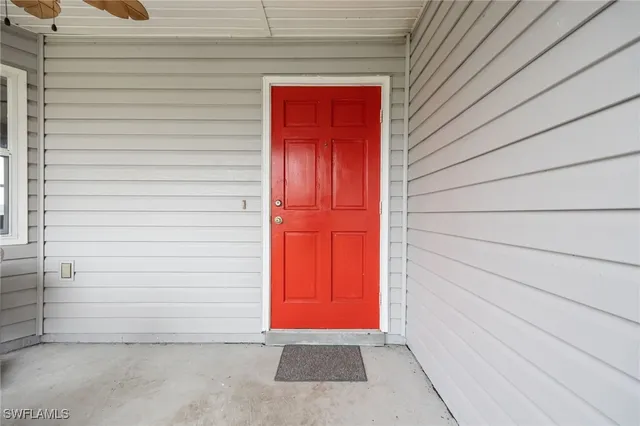 a living room with lots of furniture and kitchen view