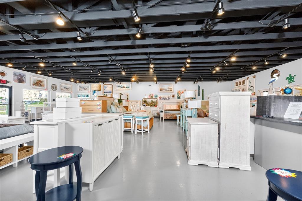 4275 South Access Road Englewood, FL 34224 - Photo 11 of 24 a utility room with lots of wooden furniture and appliances