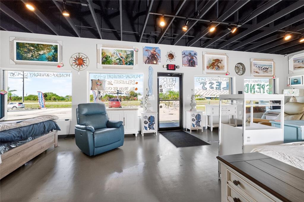 4275 South Access Road Englewood, FL 34224 - Photo 12 of 24 a living room with furniture and a flat screen tv