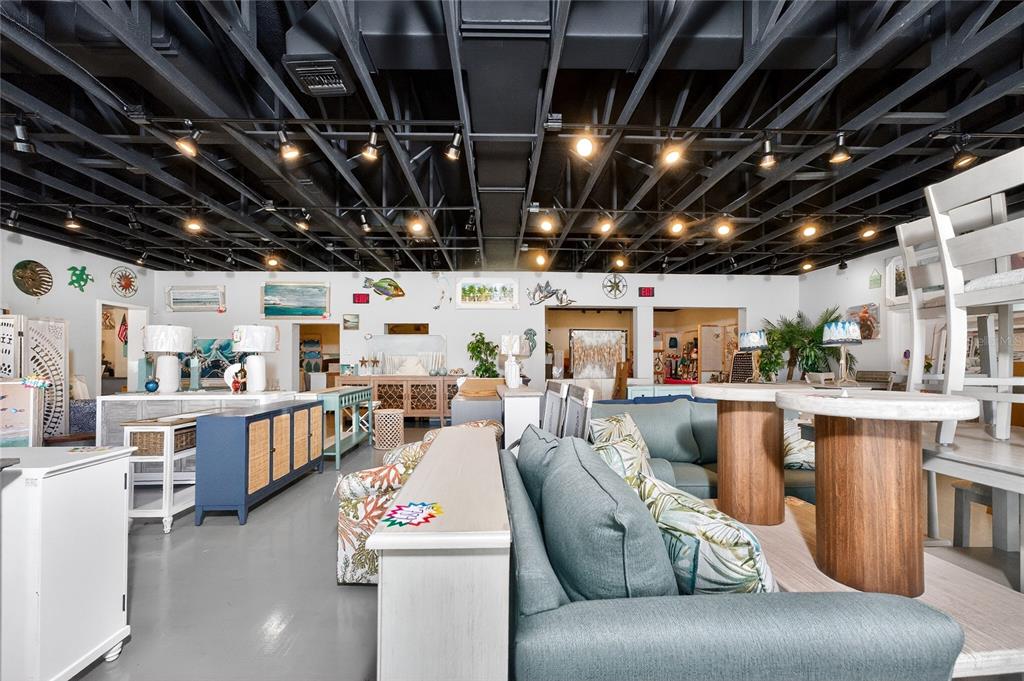 4275 South Access Road Englewood, FL 34224 - Photo 16 of 24 a living room with furniture and a view of kitchen
