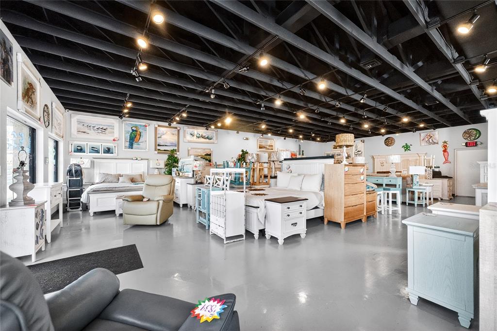 4275 South Access Road Englewood, FL 34224 - Photo 10 of 24 a storage room with lots of furniture and clutter