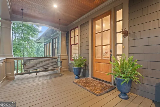 a view of dining room and kitchen with wooden floor
