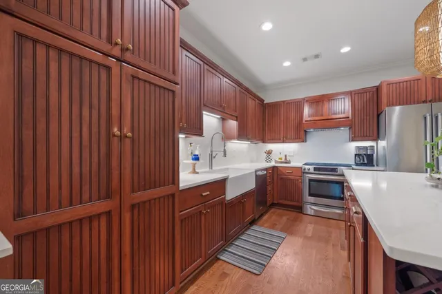 a spacious bathroom with a double vanity sink a mirror and a