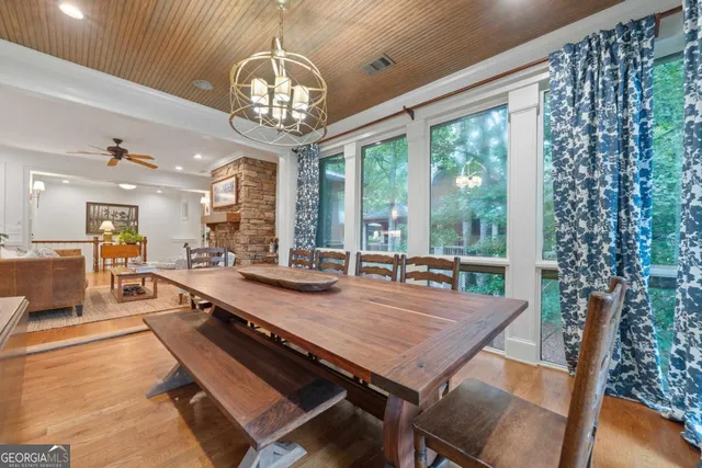 a bathroom with a toilet sink vanity and mirror