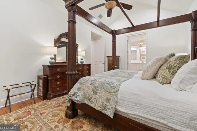 a en suite bathroom with a toilet a sink and mirror